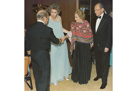 Sophia and Ed Friendly, on right, are greeted at a society function